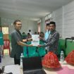 Irfan Syahril S. IP. MM Pj. Kades Baua Adolang Menyerhakan Dokumen LKKPD Kepada Ketua BPD Desa Banua Adolang Di Aula Kantor Desa Jum'at 2 Mei 2025.